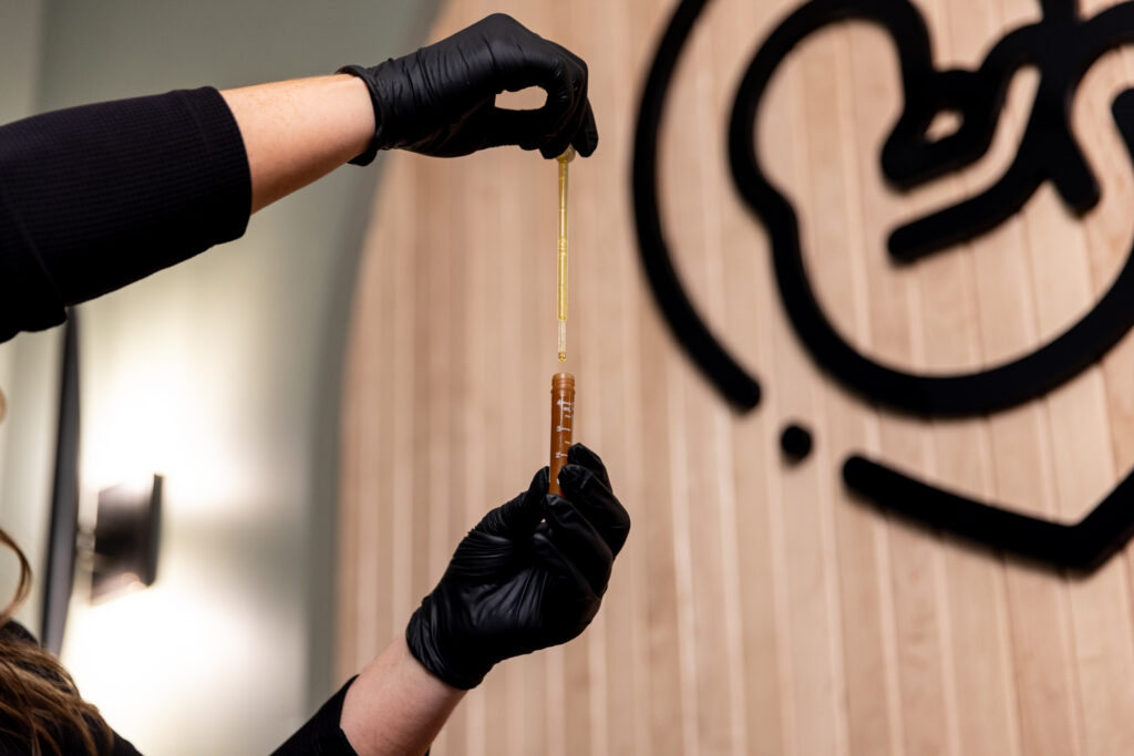 A menopause specialist in Panama City using a blood sample to run hormone testing as part of estrogen therapy in Sioux Falls.